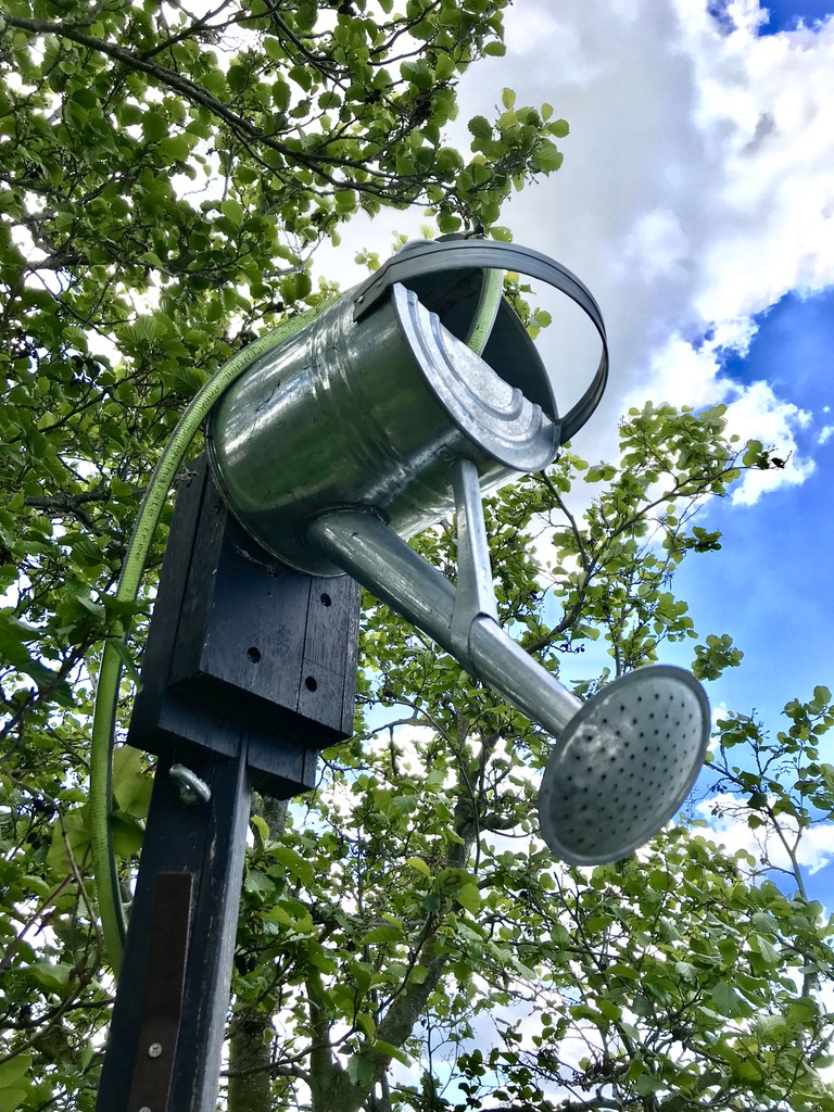 Buiten douche van gieter