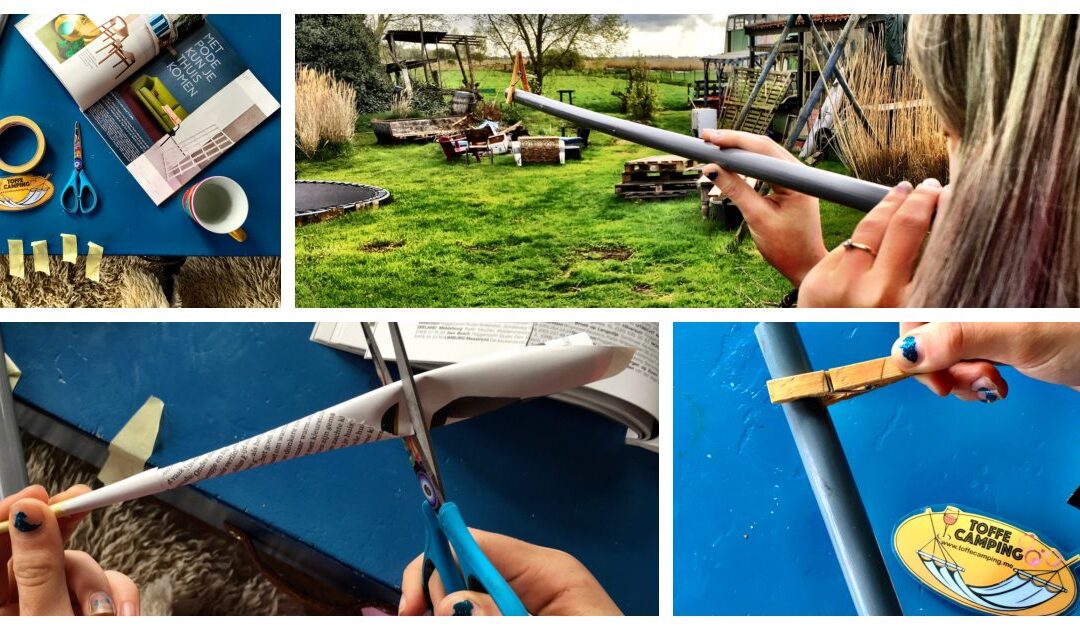 ouderwetse blaaspijp en papieren pijltjes .